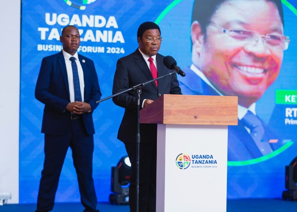 Guest of Honor, Hon. Kassim Majaliwa, Prime Minister of Tanzania, delivering his keynote address at the Uganda-Tanzania Business Forum 2024.