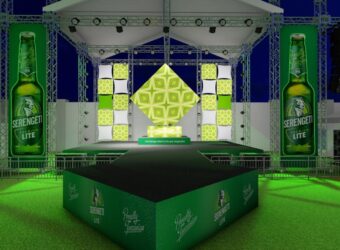 Mockup visual of the LED screen setup at 'Lite Your Imagination' event, showcasing branded Serengeti Lite content and stage lighting effects in a vibrant event atmosphere.